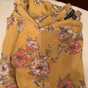 A mustard yellow romper